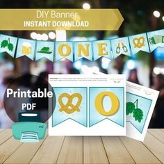 a wooden table topped with lots of paper cut outs and bunting banner kits on top of it