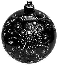 a black ornament with white dots on it