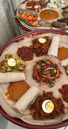 two plates filled with different types of food on top of a table next to each other