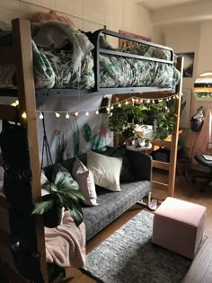 a living room filled with furniture and lots of plants on top of it's shelves