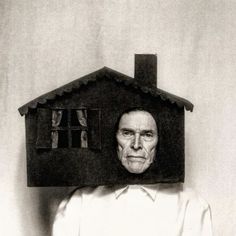 an old man with a house on his head