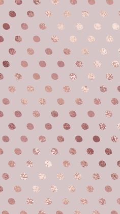 a pink and gold polka dot wallpaper