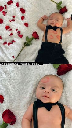 a baby laying on top of a white blanket next to red roses