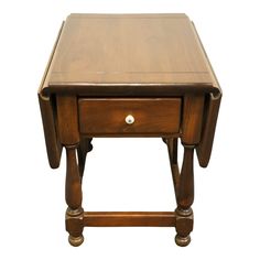 a small wooden table with two drawers on one side and an open drawer on the other