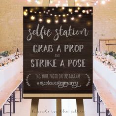 a sign that says selfie station grab a prop and strike a pose at the reception