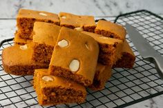 several pieces of cake sitting on top of a cooling rack