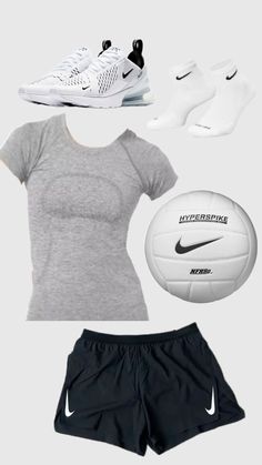 a woman's outfit with nike shoes and a soccer ball in front of her