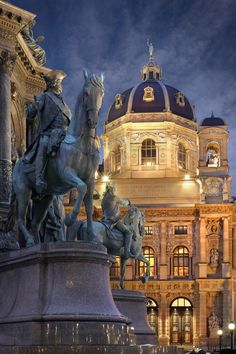 there is a statue in front of a building with a horse and rider on it