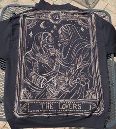 a black jacket with an image of the lovers on it