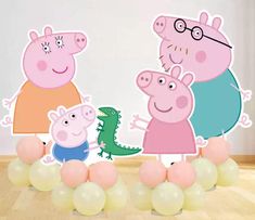 peppa pig and her friends are standing in front of some balloons on the floor