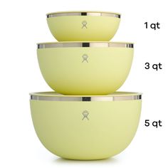 three yellow bowls sitting next to each other on top of a white surface with measurements