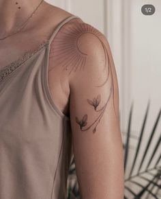 a woman with a tattoo on her arm