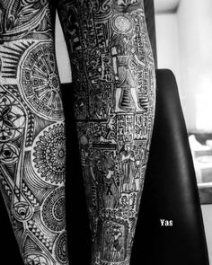 a person with tattoos on their legs