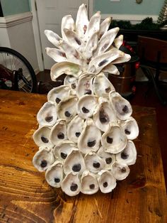 a pineapple shaped sculpture sitting on top of a wooden table