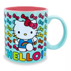 a hello kitty coffee mug with the word hello on it's front and side