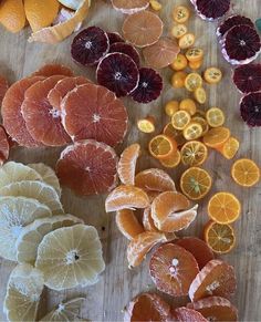 oranges, lemons and grapefruit cut up on a cutting board