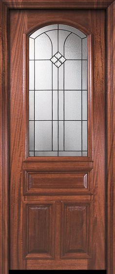 a wooden door with stained glass on the top and bottom panel, sidelights above