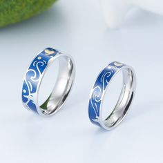 two rings with blue and white designs on them