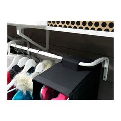 a rack with several pairs of shoes hanging from it's sides and two bins on the other side