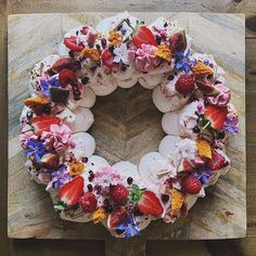 a cake decorated with strawberries and flowers