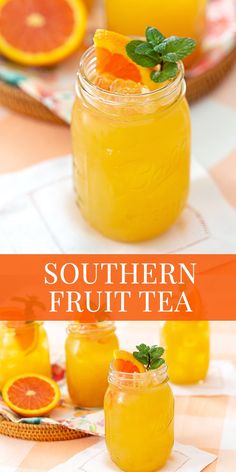 two jars filled with orange juice and garnished with fresh mint on the side