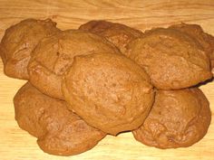 a pile of cookies sitting on top of a wooden table