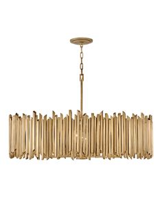 a chandelier made out of bamboo sticks on a white background with a chain hanging from the ceiling