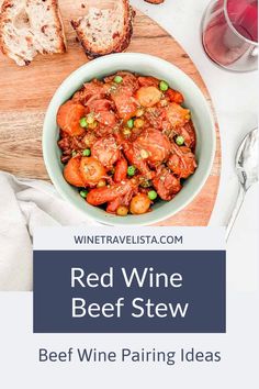 red wine beef stew in a bowl with bread on the side