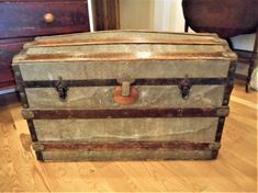 an old trunk is sitting on the floor