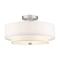 a ceiling light with a white shade on it