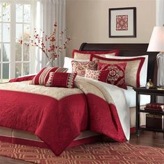 a red and white bed in a bedroom