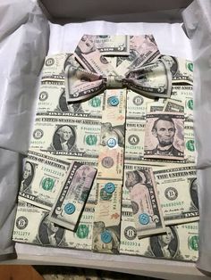 a bow tie made out of money in a box