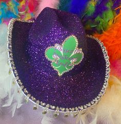 Custom hat price includes the hat, glitter or paint of the hat, trim, label, and rhinestones surrounding the label. Extra costs include any extra dangling parts on the rim of the hat, extra rhinestones on the sides of the hat, two tones of glitter, Led lights, extra labels, ect. You can include a name, number, or Mrs. Feel free to message me any special requests or design a hat with me! The circumference of all the hats are 24 inches, I offer hat inserts on my page for $5. White hat price will b Mardi Gras Cowboy Hat, White Hat, Custom Hats, Cowboy Hat, Mardi Gras, The Label, Cowboy Hats, 10 Days, Accessories Hats