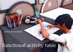 a little boy sitting at a table with some crayons and colored pencils