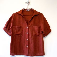 Elevate Your Wardrobe With This Wishlist Apparel Rust Burnt Orange Button-Up Blouse! Crafted From 100% Polyester, This Blouse Combines Style And Comfort Seamlessly. Its Short Sleeves And Button-Up Design Add A Touch Of Sophistication To Any Ensemble. Designed In A Size Small, It Offers A Flattering Fit For All-Day Wear. Hand Wash Cold And Lay Flat To Dry To Maintain Its Pristine Condition. Never Worn And In Like-New Condition, This Blouse Is Ready To Become A Staple In Your Closet. Don't Miss Th Patterned Button Down, Business Casual Blouses For Women, Burnt Orange Clothes, 70s Button Up Shirt, Short Sleeve Tops For Women, Marc Spector, Floral Silk Shirt, Business Casual Blouse, Mom Vibes