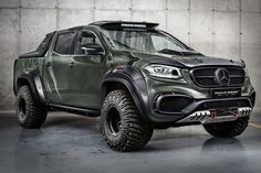 the mercedes benz pickup truck is parked in a garage