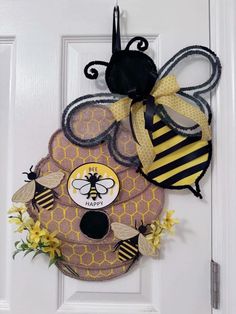 a door hanger with a bee on it