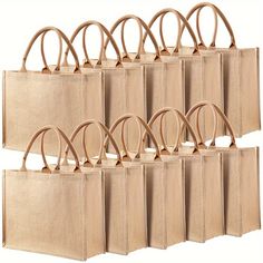 six bags with handles are lined up against each other, all in different shapes and sizes