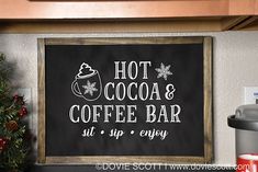 a chalkboard sign that says hot cocoa and coffee bar at sip - enjoy on the kitchen counter