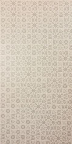 a white and beige wallpaper with an intricate design on the bottom half of it