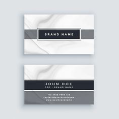 two business cards with black and white stripes