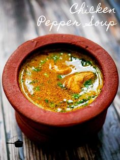 chicken pepper soup in a red bowl on a wooden table with the words chicken pepper soup above it