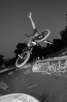 a man riding a skateboard up the side of a ramp