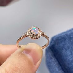 >>>> BASIC OPAL INFORMATION <<<< Round Opal : 5*5mm.Main stone: Natural good fire opal.Side stone: dainty cz diamond (cubic zircon).Material: 925 Sterling Silver +Natural opal stone.Metal color: silver, gold, rose gold. Metal materials: 925 sterling silver, 18K rose gold Plated, 18K rose gold Plated.>>>> SIMPLE DESIGN AND GOOD FIRE <<<>>> CUSTOM METALS <<<< Ring Size: From US #2 to US #15.Supply customized Solid Gold (9K, 14K and Formal Opal Ring With Cubic Zirconia, Adjustable Elegant Opal Crystal Ring, Elegant Adjustable Opal Crystal Ring, Elegant Opal Crystal Ring With Birthstone, Elegant Opal Birthstone Crystal Ring, Elegant Opal Crystal Ring, Elegant Opal Crystal Ring With Gemstone, Elegant Opal Gemstone Crystal Ring, Elegant Round Pink Opal Jewelry