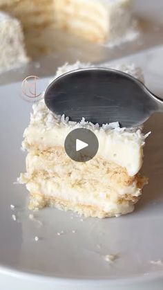 a piece of cake on a plate with a spoon