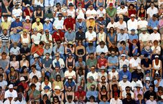 a large group of people sitting next to each other