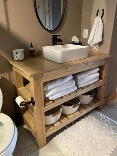 a bathroom with a sink, toilet and towel rack