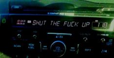 an old radio with the words shut the f k up on it's display