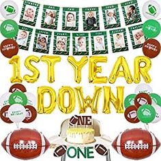 a football themed 1st year down banner with balloons and decorations for a one year birthday party