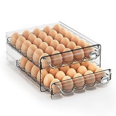 two clear trays filled with brown eggs